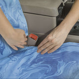 Woman Tucking Cool Blue Marble Car Seat Cover  Into Seat